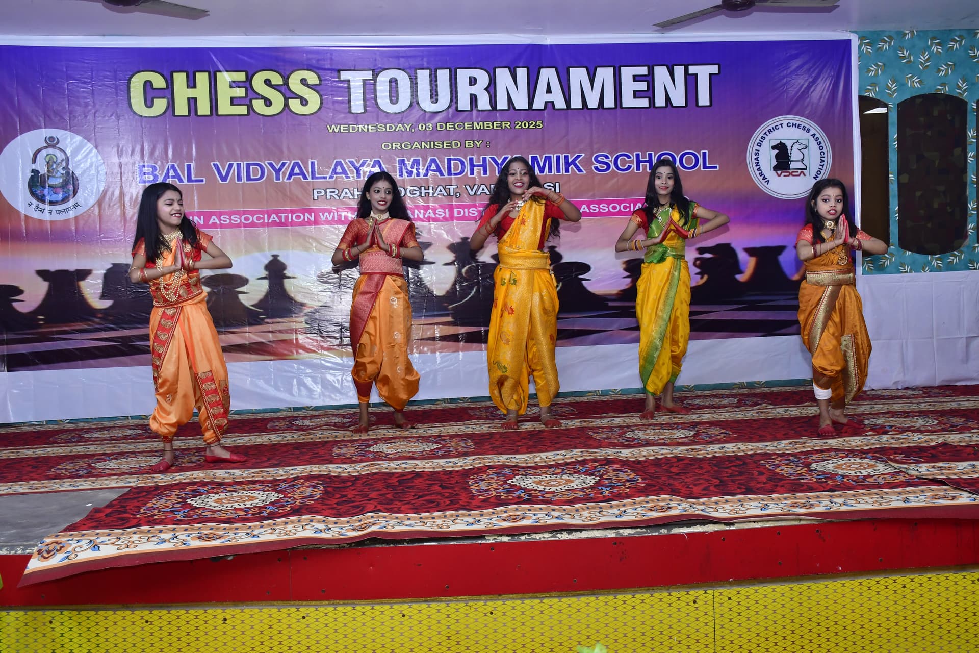 Students playing chess and focusing on their strategy at the Bal Vidyalaya Chess Championship event.
