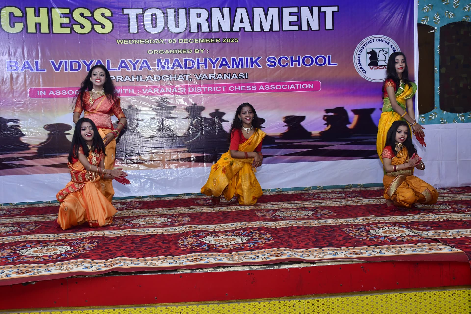 Students playing chess and focusing on their strategy at the Bal Vidyalaya Chess Championship event.