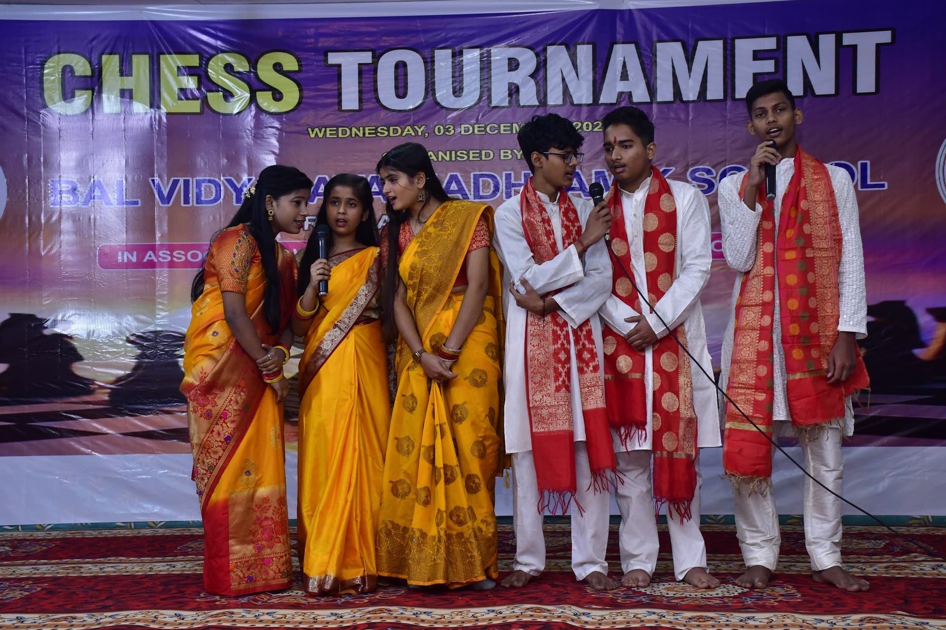 Students playing chess and focusing on their strategy at the Bal Vidyalaya Chess Championship event.